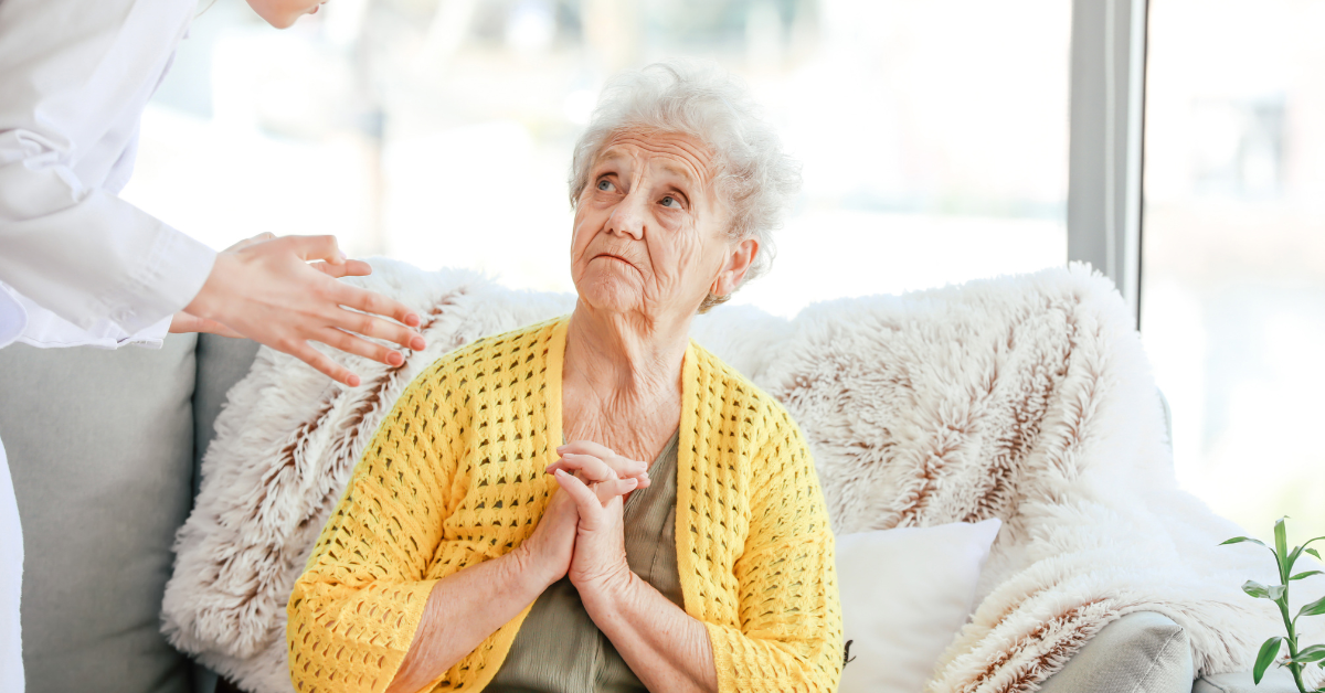 Elderly woman experiencing nursing home verbal abuse